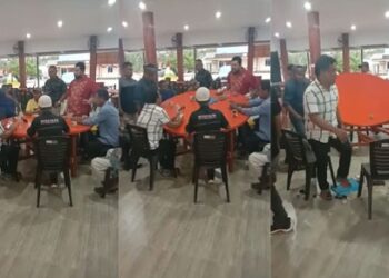 Suherman (baju merah) membalikkan meja saat bertemu Ketua DPC Ampuh, Budiman Sitompul, di Galang (Foto: Tangkapan gambar video berdurasi 35 detik)