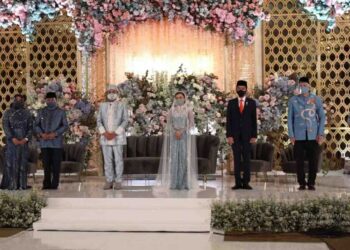 Presiden Jokowi hadir dan jadi saksi pernikahan Politisi Golkar Idris Laena di Hotel Mulia, Jakarta , Sabtu, 3 April 2021. (Foto: H. Achmad Ristanto)