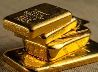 Foto ilustrasi emas batangan, logam mulia. (Foto: Ist./SHUTTERSTOCK/VLADKK).